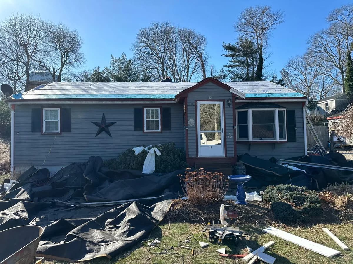 Cape-style house after an asphalt shingle roof replacement