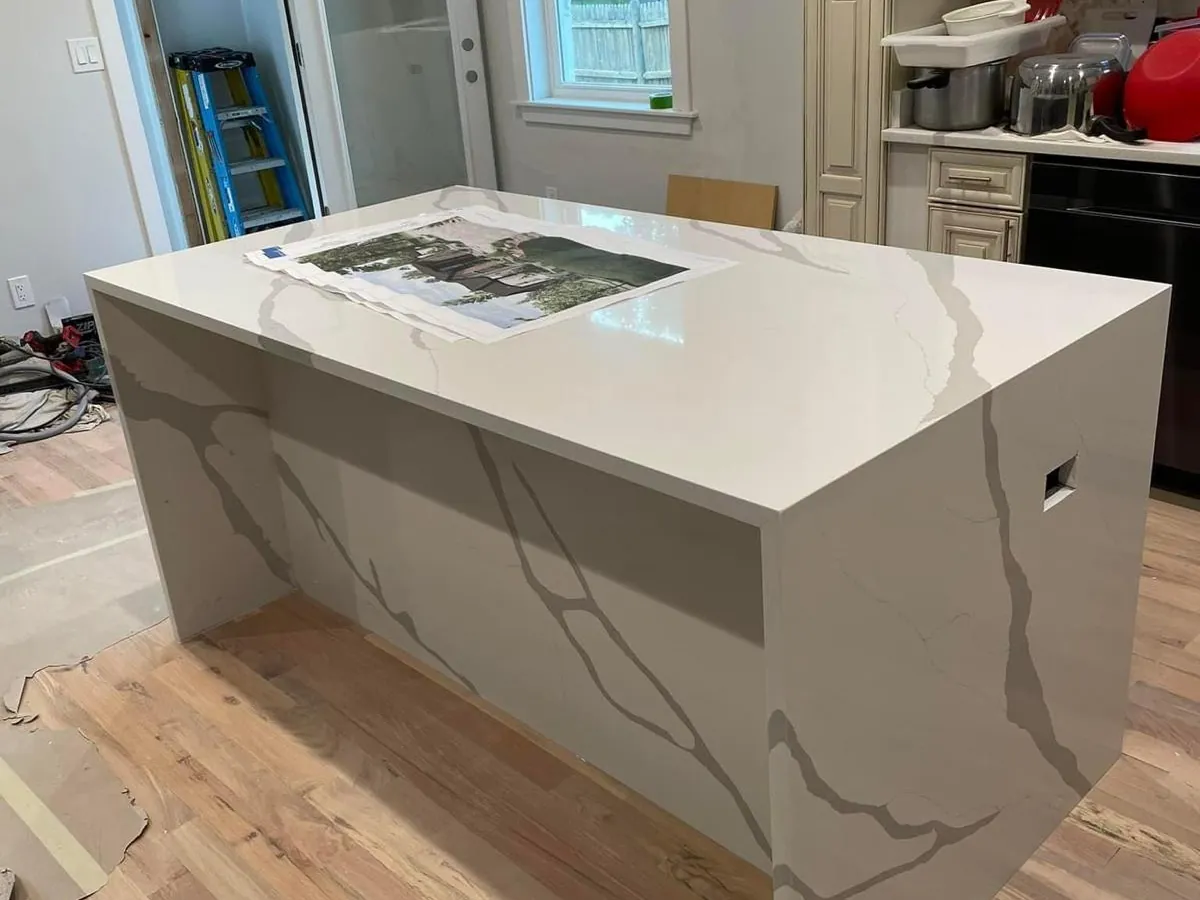 Quartz waterfall kitchen island during a home renovation