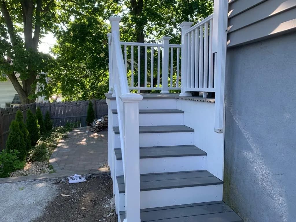 White PVC exterior stairs with gray composite treads